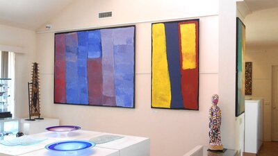Colourful paintings, sculptures and art glass.